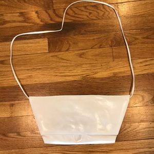 Charles Jourdan ivory leather clutch with strap